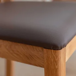 Esstischstuhl aus Wildeiche mit Kunstleder Sitz - Ernestan