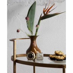 Ovaler Serviertisch Burina auf Rollen in Messing mit Glas