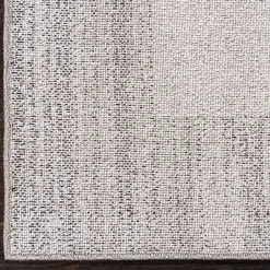 Teppich in Hellgrau mit dunkelgrauem Rand - Armina