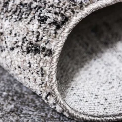 Teppich in Hellgrau mit dunkelgrauem Rand - Armina